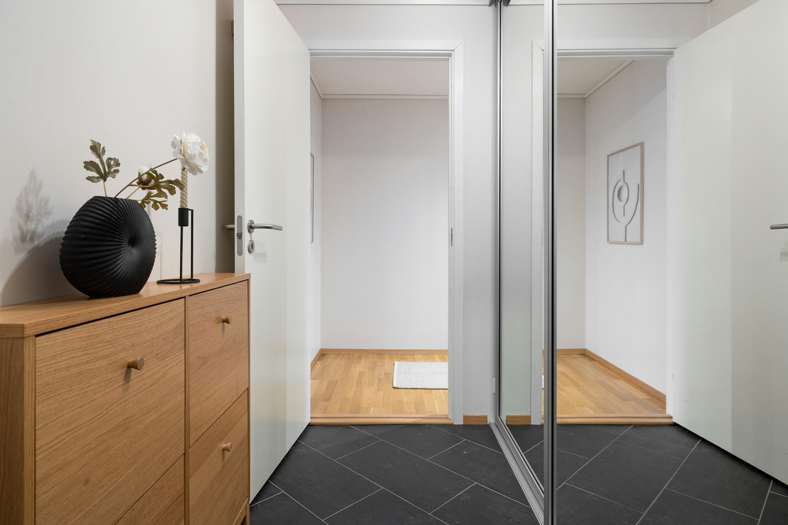Modern bathroom with walk-in shower and tiling in a new-build apartment