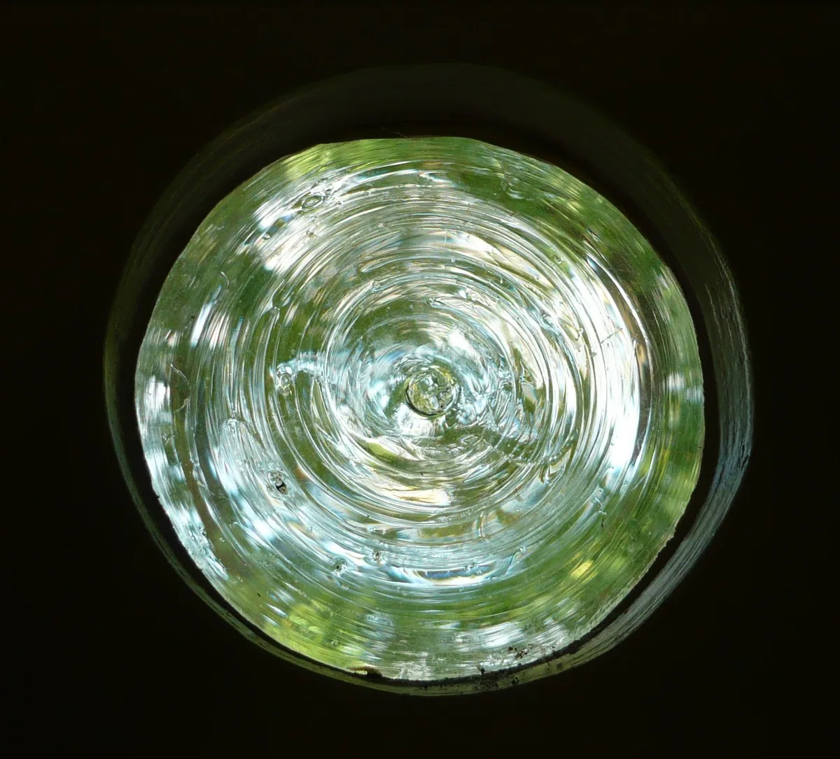 Round disc of crown glass with circular ripples in a window of the Hamtoren in Utrecht