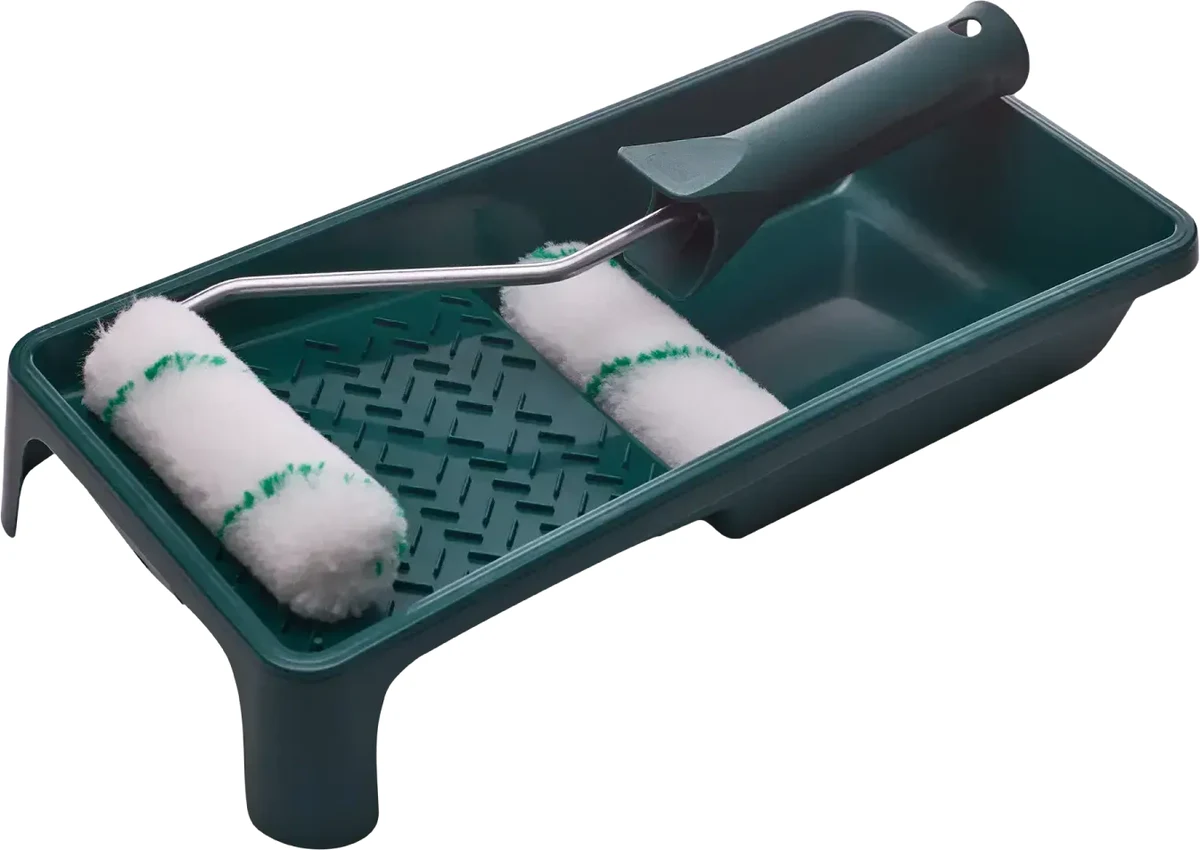 A green paint tray with two white paint rollers with green thread and a roller handle