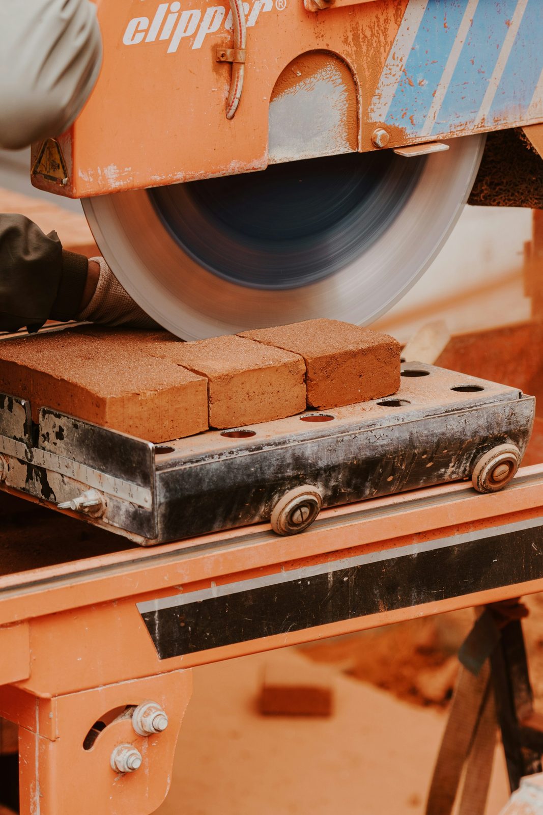 Bricks being cut to size with a masonry saw
